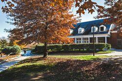 View of Annapolis Hall dormitory surrounded by fall foliage, home to the Department of Resident Life.
